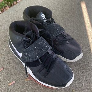 Black Kyrie sixes. Size 10 in men’s.